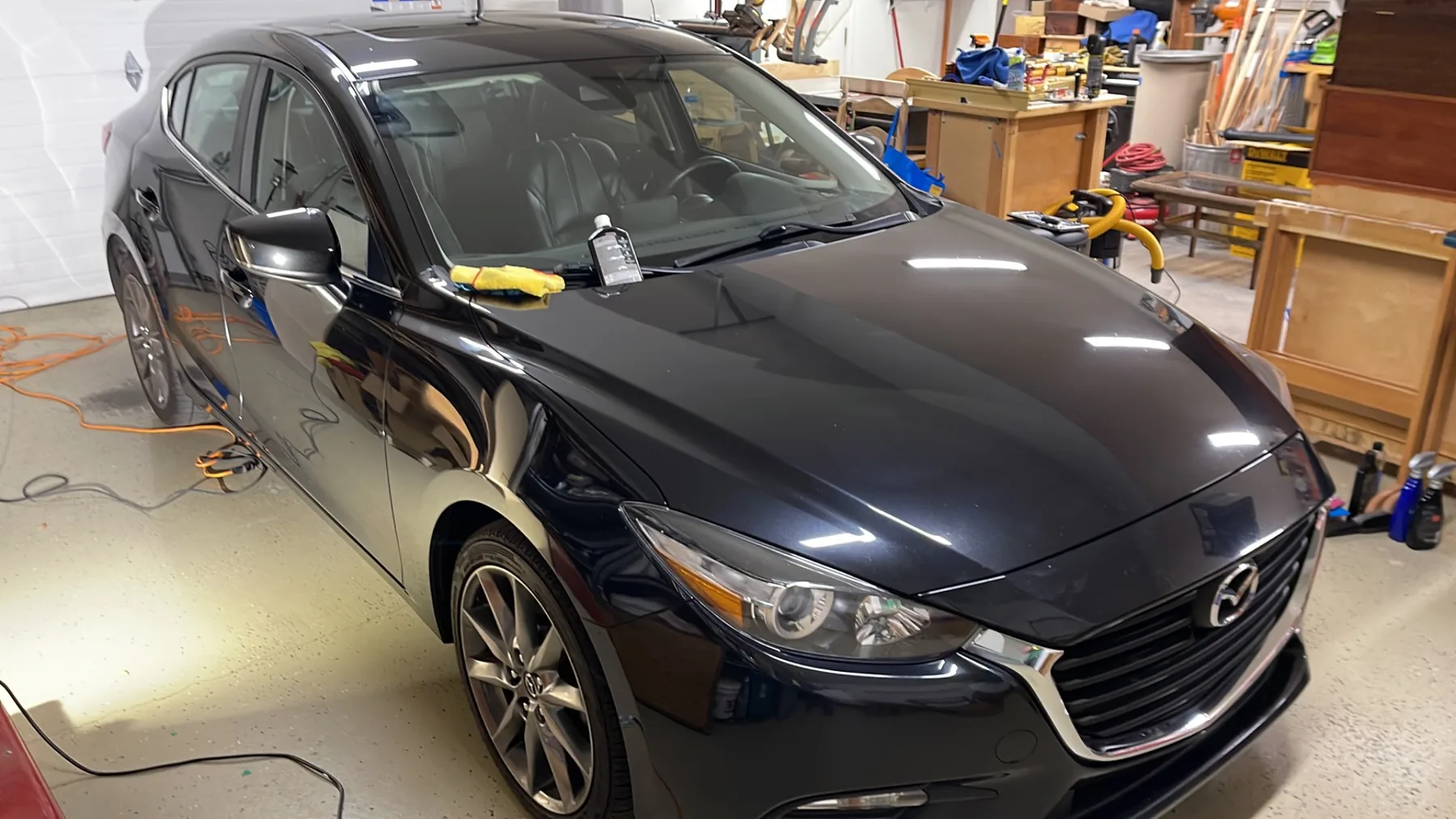 Glossy black Mazda after premium detailing and paint enhancement
