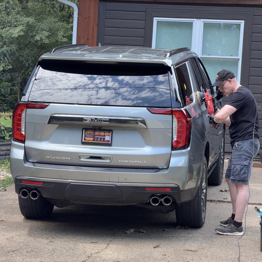Lars Carlsen polishing a GMC Yukon Denali