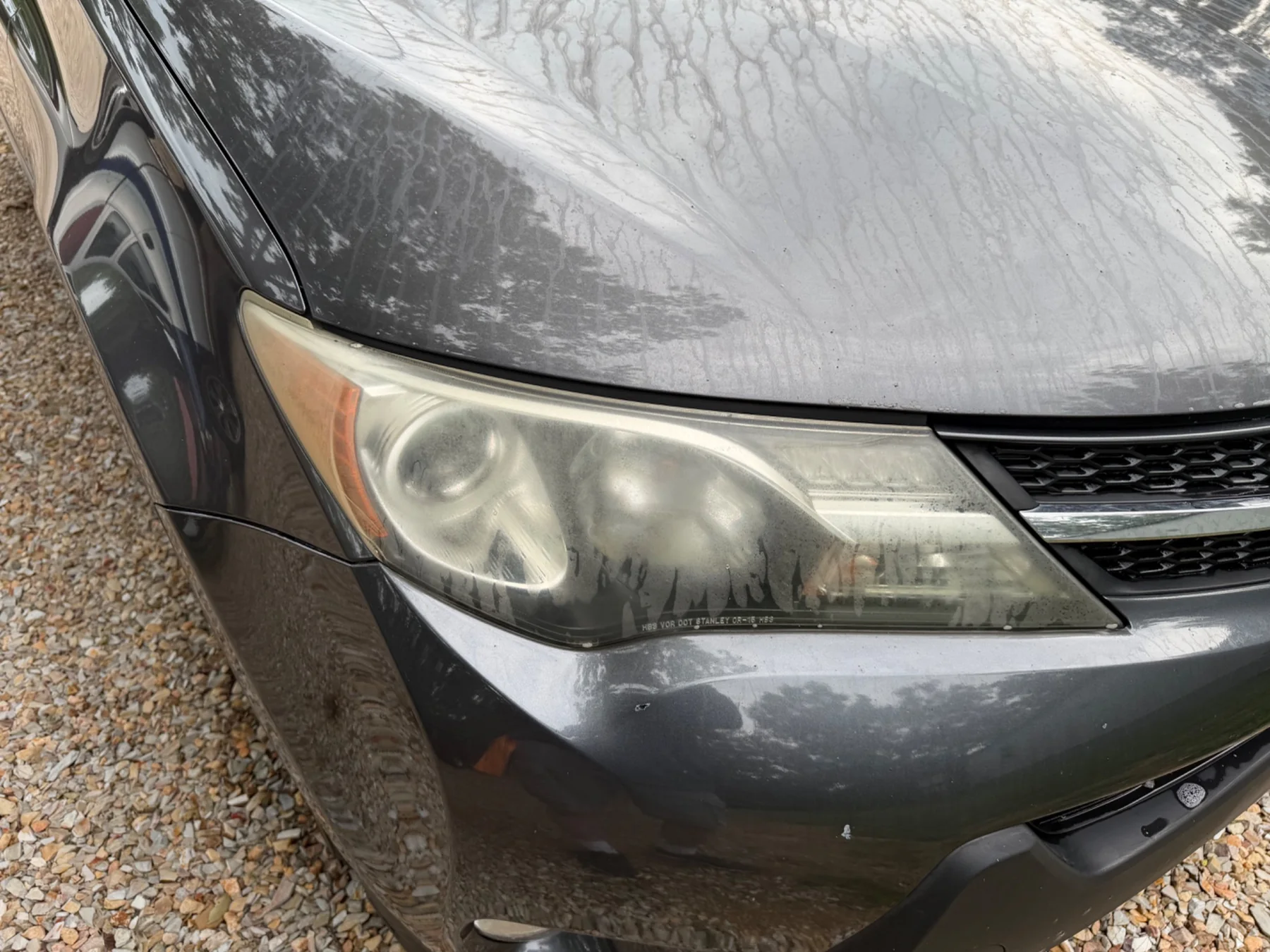 Cloudy RAV4 headlight before restoration
