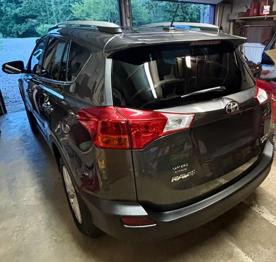 Finished gray Toyota RAV4 after rear trim restoration